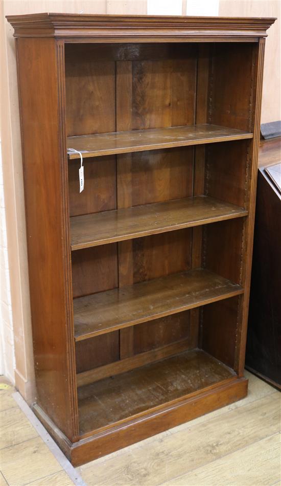 A Victorian walnut open fronted bookcase, fitted adjustable shelves and standing on a plinth base, H.143cm W.81cm